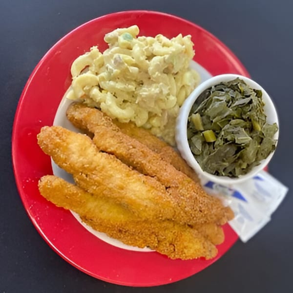 Aunt Berta's Kitchen fried fish, macaroni salad, and collard greens on a red plate.