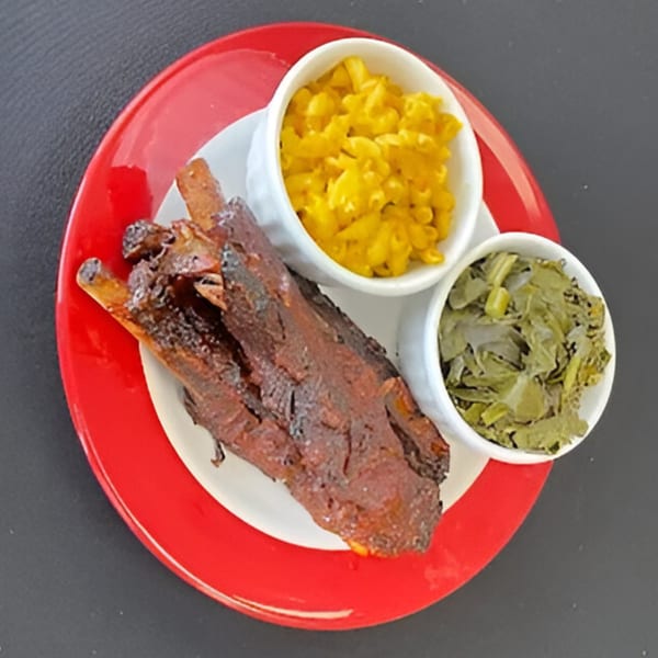 Aunt Berta's Kitchen's soul food plate with ribs, macaroni and cheese, and collard greens.